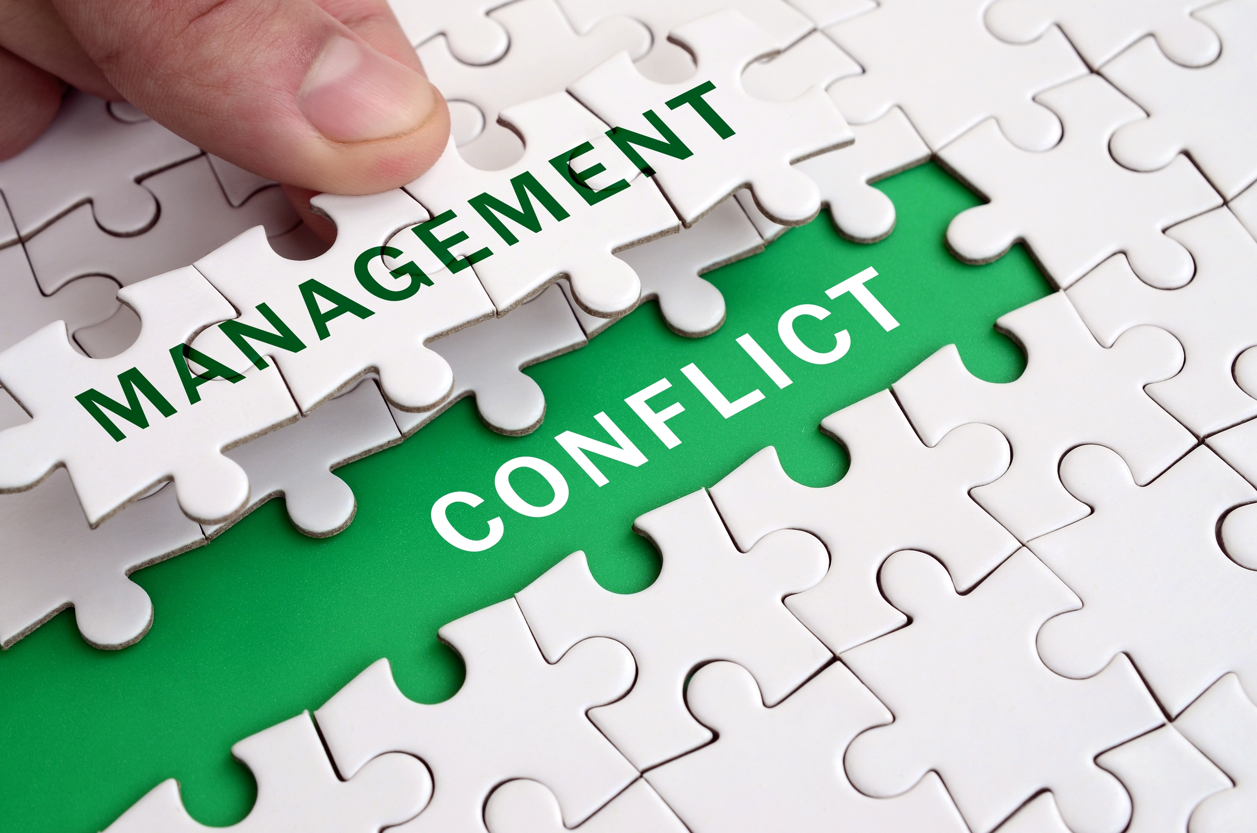 Conflict Management Styles A Must Read Guide For Employers Shiftbase The Human Hand Fills The Last Missing Elements Puzzle Saying Conflict Managament